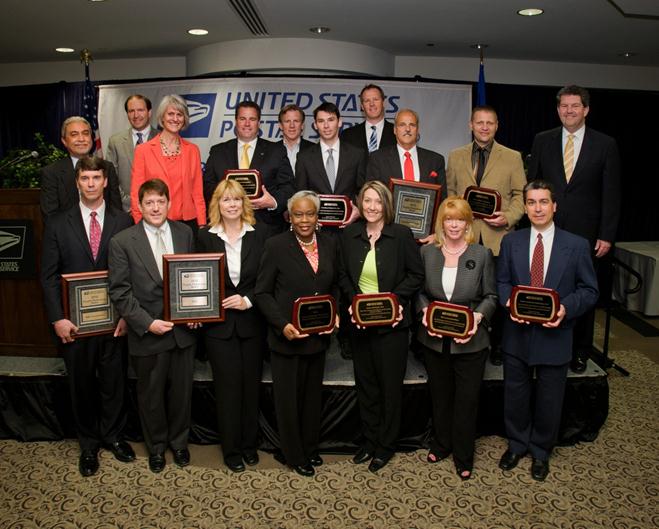Back row (left to right): Ellis A. Burgoyne, chief information officer and executive VP, U.S. Postal Service; John T. Edgar, vice president, Information Technology, U.S. Postal Service; Susan M. Brownell, vice president, Supply Management, U.S. Postal Service; Andy Clark, assistant VP Corporate Account Manager Government and Education, Ecolab Pest Elimination, Supplier Excellence Award; Joseph Corbett, chief financial officer and executive VP, U.S. Postal Service; Chris Dill, USPS project manager, Carolina Cabinet Co., Inc., Supplier Excellence Award; Jayme Oyen, Emergency Services Sales, Sun Coast Resources, Inc., Supplier Excellence Award; Larry Graves, VP of Stamps to Go Program Operations and Government Sales, American Bank Note Company, Supplier Performance Award; Steve Koneval, executive vice president, Roth, a Sodexo Company, Supplier Innovation Award; Patrick R. Donahoe, postmaster general and chief executive officer, U.S. Postal Service; Front row (left to right): Dan Dougherty, Federal Division vice president, EMC Corporation, Supplier Performance Award; John Stampfel, vice president, General Manager, Electrical Engineering Services and Systems, and Brenda Etzel, Global Client director, Eaton, Supplier Performance Award; Deborah Pickens, director Supplier Diversity, World Headquarters Supply Chain, Eaton, Supplier Diversity Award; Beverly Drew, chief executive officer, Asset LifeCycle, LLC, Supplier Sustainability Excellence Award; Laura Thomas, chief executive officer, XO Communications, Supplier Excellence Award; John Kassiri, client director, Foth Production Solutions, LLC, Supplier Innovation Award.