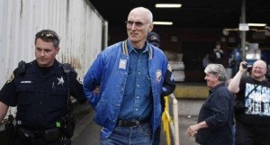 Jamie Partridge being led away by Salem police 