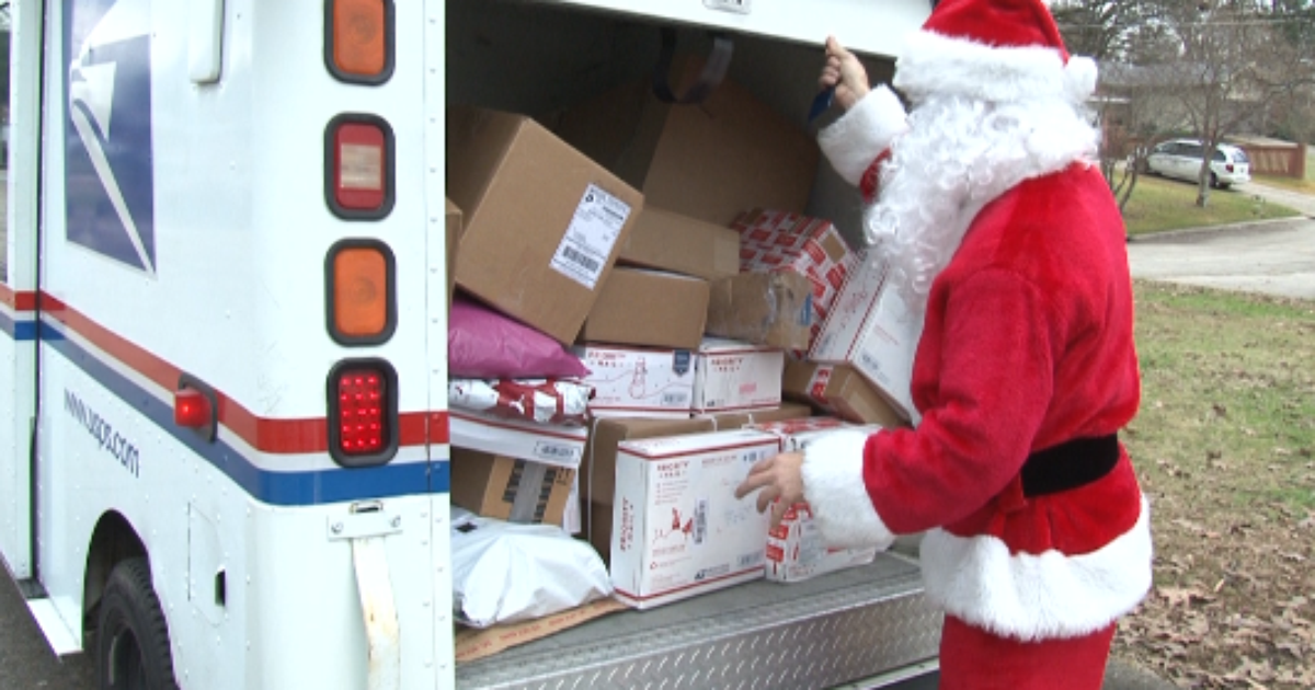 Video Mail Carrier delivers packages Santastyle