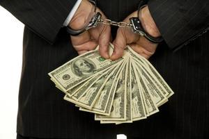 embezzlement_cuffedhands_money-optimized