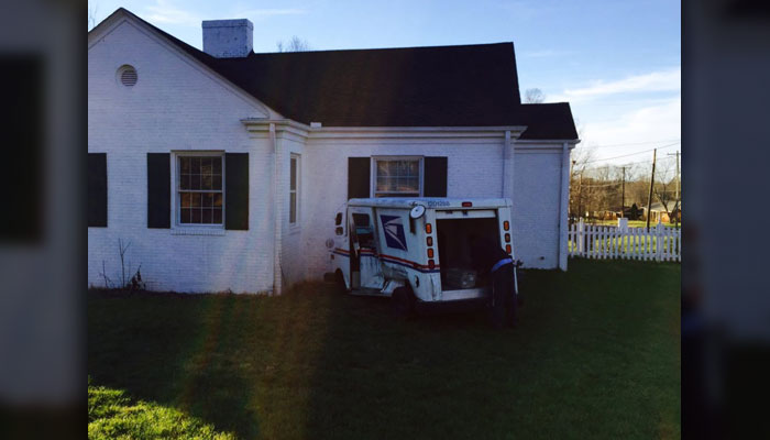 Mail truck strikes house during accident