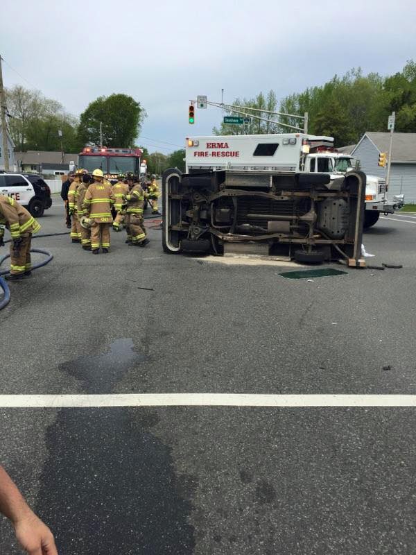New Jersey firefighters free trapped letter carrier from flipped mail truck
