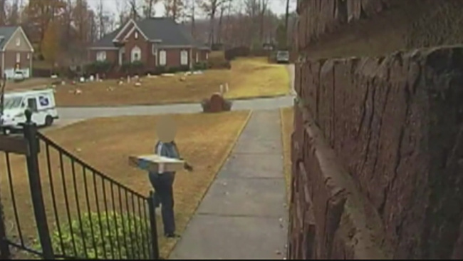 postal-worker-caught-throwing-package